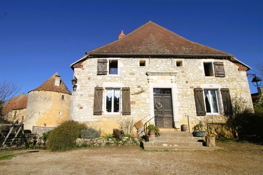 In a beautiful village with shops and services, charming stone house for sale.