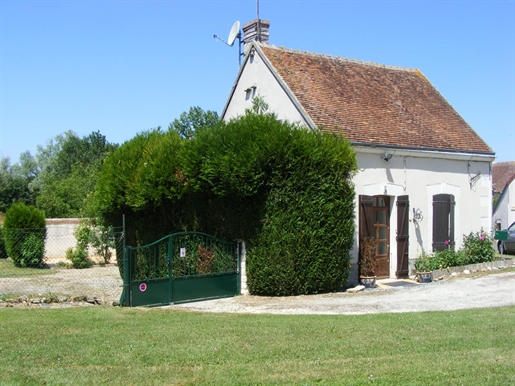 Small house with outbuildings and garden