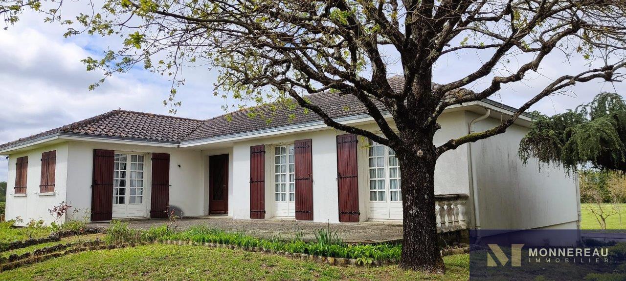 House And Building Combination On A Large Land