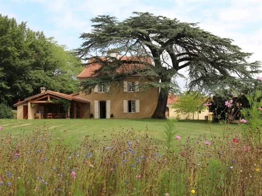 A beautifully renovated Gascon maison de maitre with many original features, providing an idyllic en