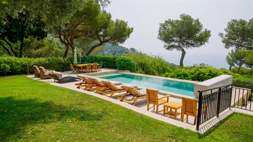 Nestled in Eze, on an expansive 9,000 m2 plot, this superb luxury villa spans 350 m2 across two floo