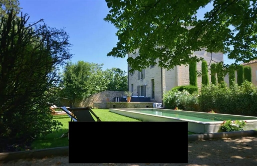 In the heart of Uzes and close to the famous Place aux Herbes, you will discover this old mansion of