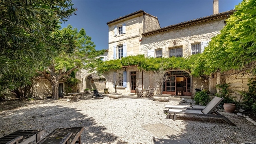 In the heart of the charming village of Fontvieille, this handsome, stone-built period farmhouse has