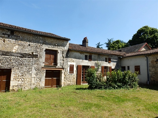 Traditional stone village house with outbuildings and large attached garden