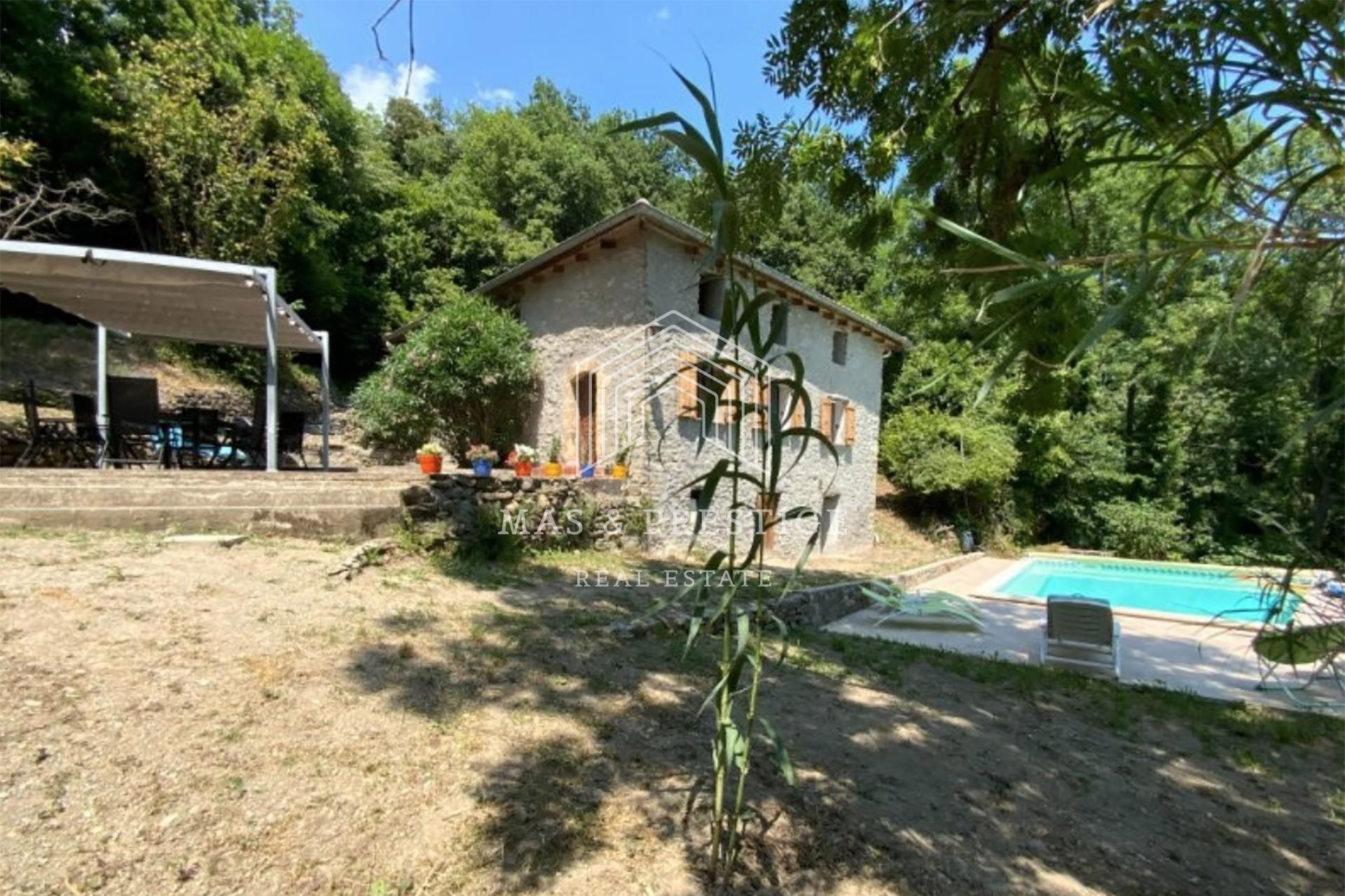 Two farmhouses in a peaceful and green setting